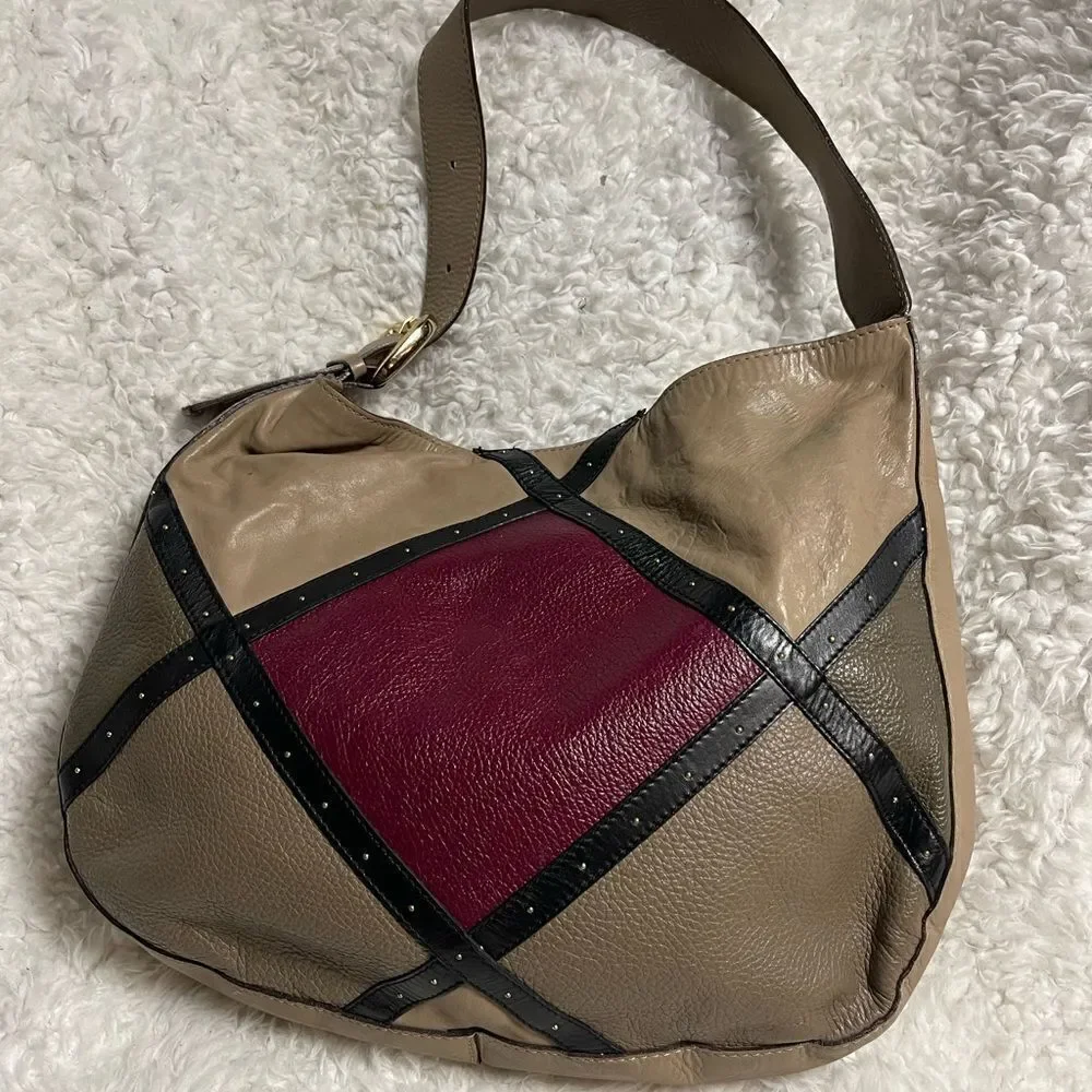 A. Bellucci leather Khaki Satchel with patch work accents, gay, burgundy &black.